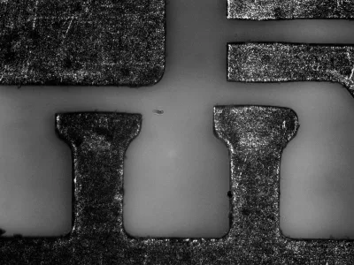 Scratches on a stainless steel surface emphasized by coaxial illumination.